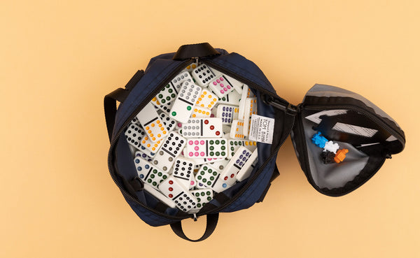 A Navy Parapack Grab Bag filled with dominoes and a Small Cloud Q-Kit attached.